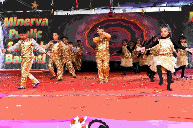 Students performing in golden costumes