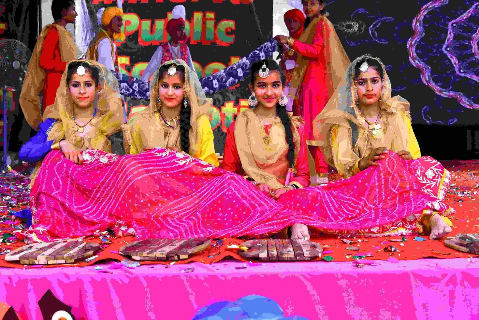 Students in traditional dress performing a folk dance